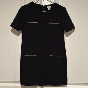 Black shift dress with gold zipper details